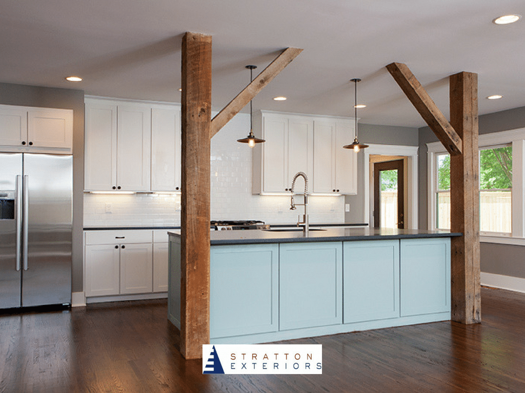 Kitchen With Blue Counters and Wood Beams